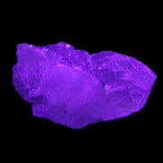 Clear with Purple Fluorite cluster 92*45*42mm 216.8g in UV light