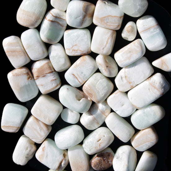 Caribbean Calcite 41 tumbled stones 20*10mm - 27*20mm 590g Wholesale in sunlight - Rocks and Things Store