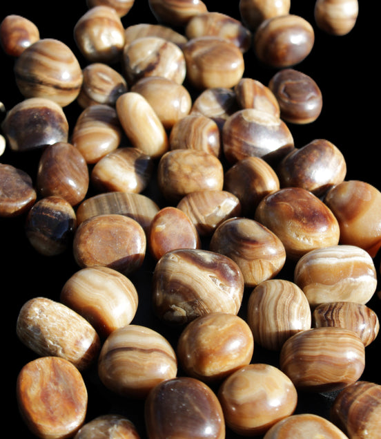 Chocolate Calcite 55 tumbled stones 21*11mm - 24-23mm  810g Wholesale in sunlight - Rocks and Things Store