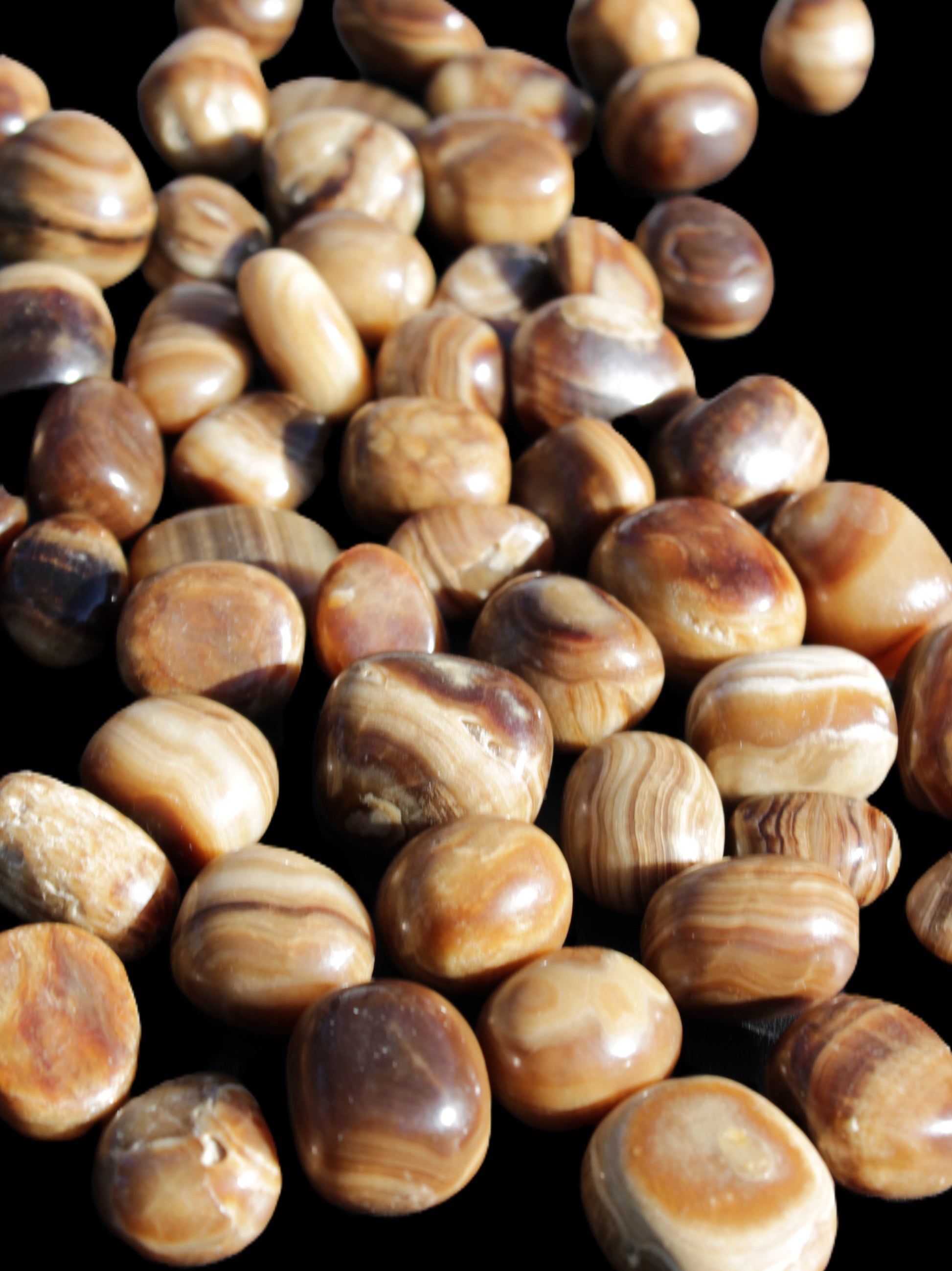 Chocolate Calcite 55 tumbled stones 21*11mm - 24-23mm  810g Wholesale in sunlight - Rocks and Things Store