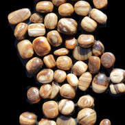 Chocolate Calcite 55 tumbled stones 21*11mm - 24-23mm  810g Wholesale in sunlight - Rocks and Things Store