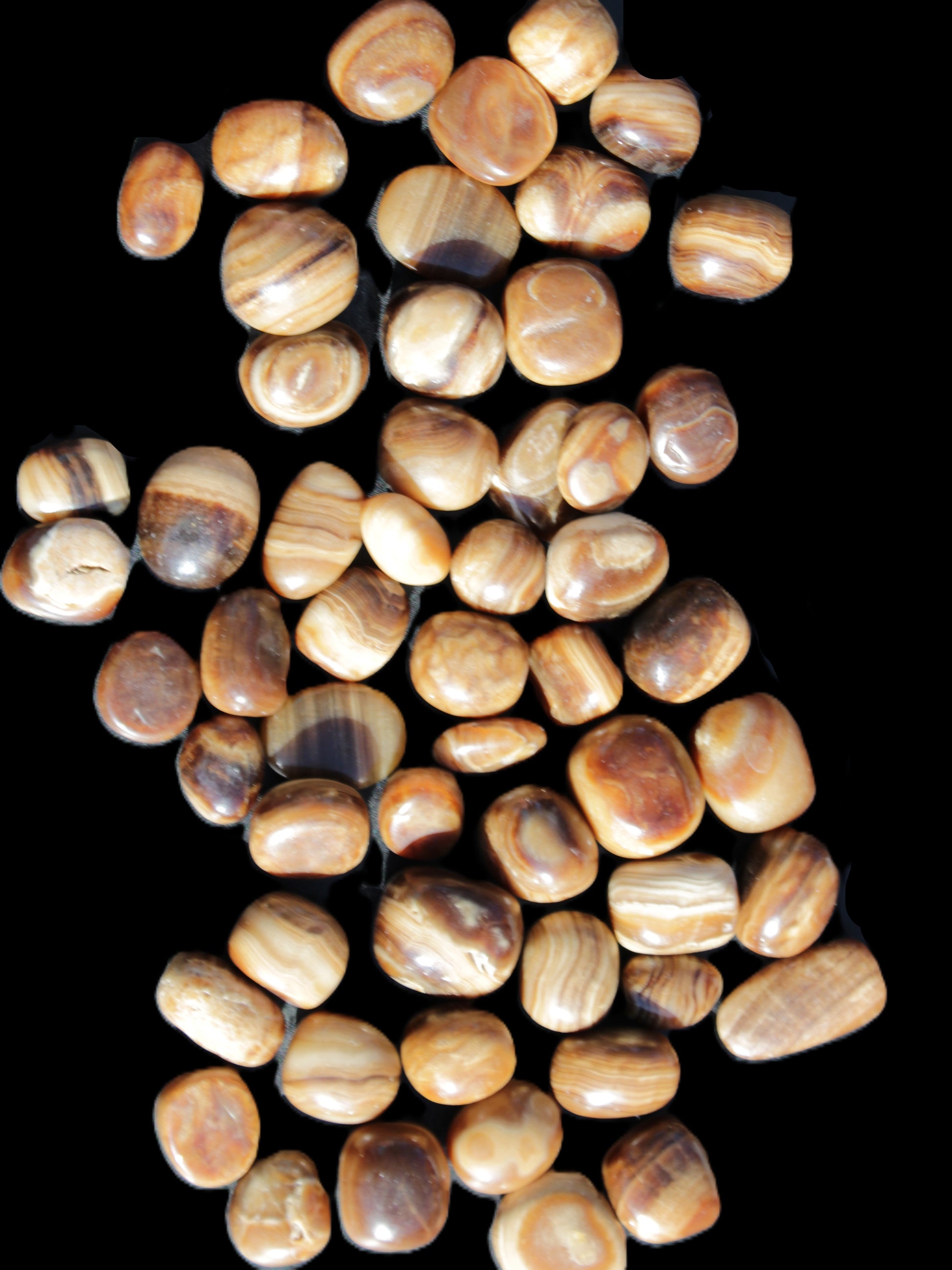 Chocolate Calcite 55 tumbled stones 21*11mm - 24-23mm  810g Wholesale in sunlight - Rocks and Things Store