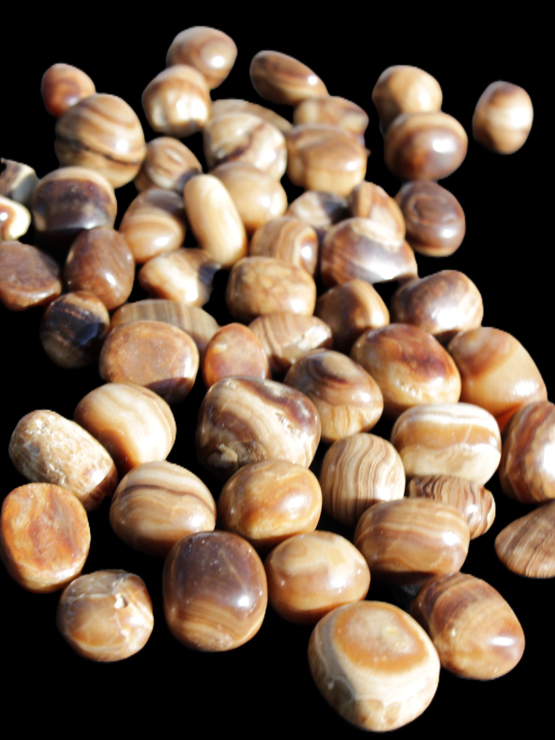 Chocolate Calcite 55 tumbled stones 21*11mm - 24-23mm  810g Wholesale in sunlight - Rocks and Things Store