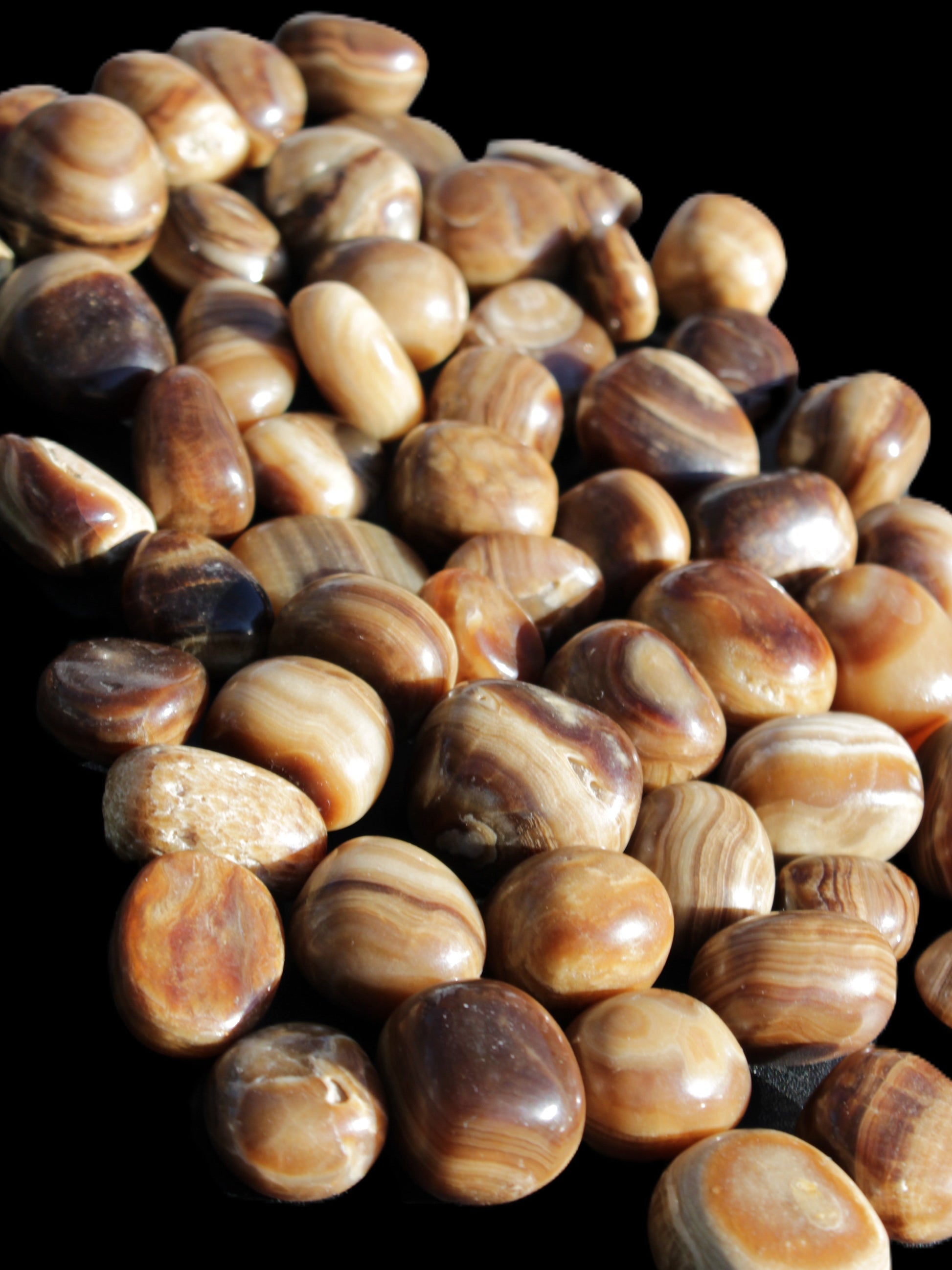 Chocolate Calcite 55 tumbled stones 21*11mm - 24-23mm  810g Wholesale in sunlight - Rocks and Things Store