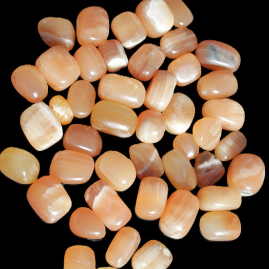 Topaz Calcite 44 tumbled stones 770g Wholesale in sunlight - Rocks and Things Store