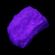 Aquamarine 44*33*19mm 247ct 49.4g in UV light