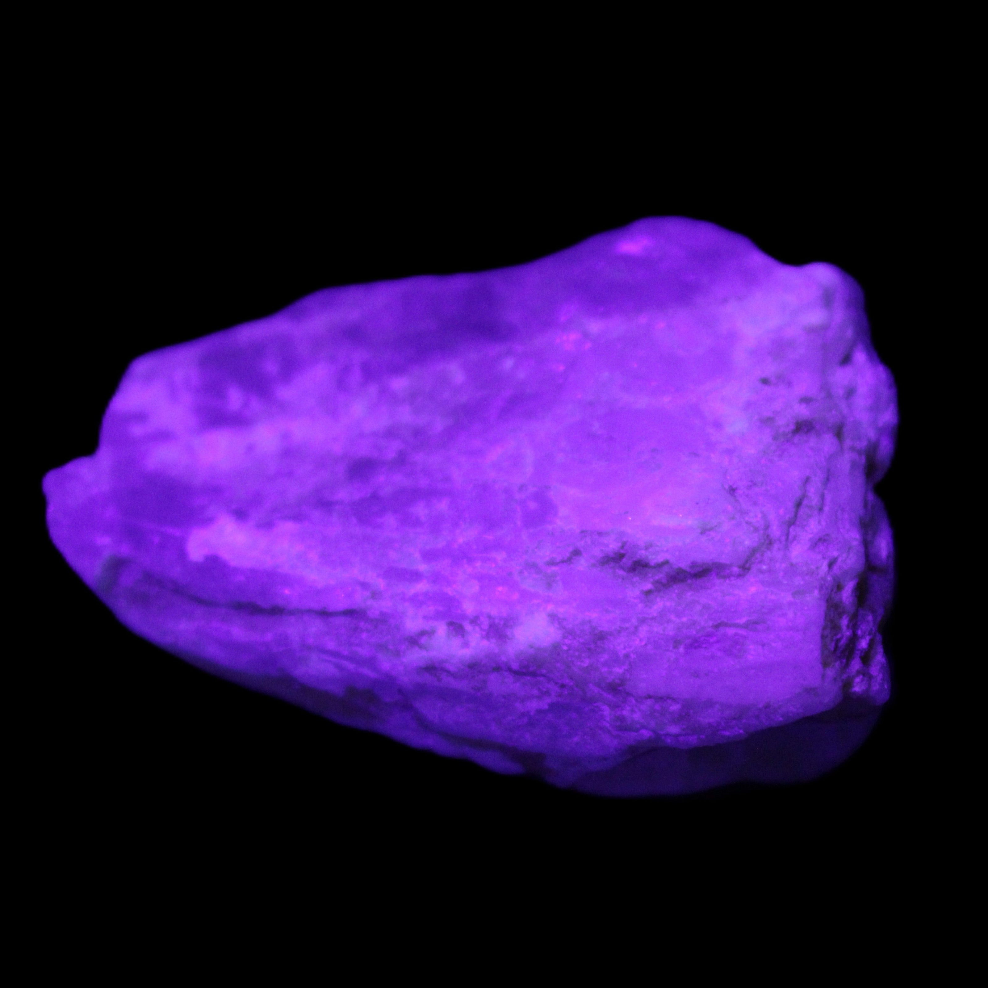 Blue Aquamarine 43*31*18mm 150ct 30g in UV light - Rocks and Things Store