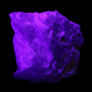 Aquamarine crystal on Quartz and Mica matrix 47*45*29mm 420.5ct 84.1g in UV light - Rocks and Things Store