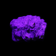 Spessartine garnet cluster 45*38*27mm 334ct 66.8g in UV light 
 - Rocks and Things Store