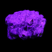 Spessartine garnet cluster 45*38*27mm 334ct 66.8g in UV light 
 - Rocks and Things Store