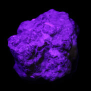 Spessartine garnet cluster 45*38*27mm 334ct 66.8g in UV light 
 - Rocks and Things Store