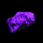 Spessartine garnet cluster 45*38*27mm 334ct 66.8g in UV light 
 - Rocks and Things Store