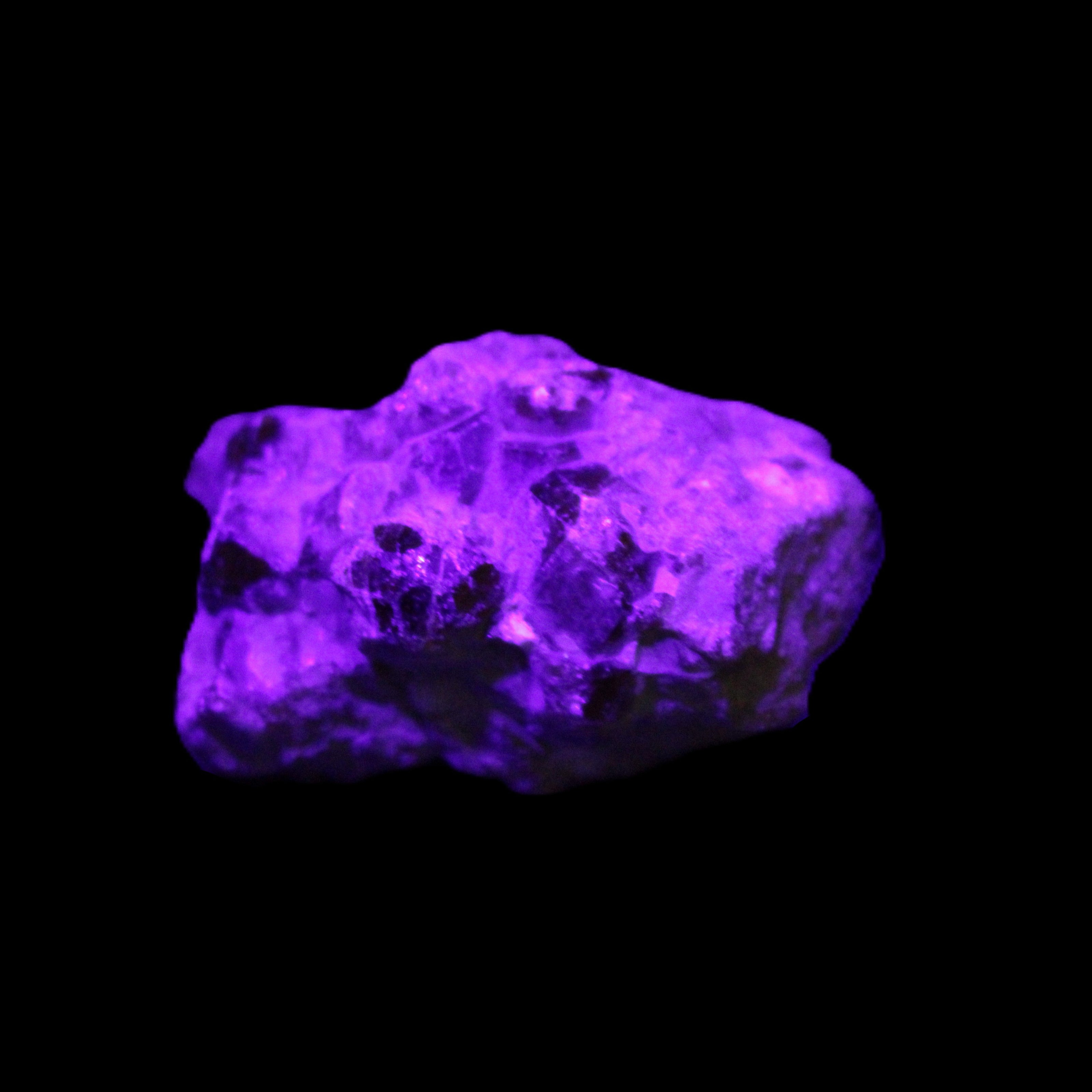 Spessartine garnet cluster 45*38*27mm 334ct 66.8g in UV light 
 - Rocks and Things Store