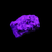 Spessartine garnet cluster 45*38*27mm 334ct 66.8g in UV light 
 - Rocks and Things Store