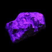 Spessartine garnet cluster 45*38*27mm 334ct 66.8g in UV light 
 - Rocks and Things Store