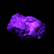 Spessartine garnet cluster 45*38*27mm 334ct 66.8g in UV light 
 - Rocks and Things Store