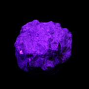 Spessartine garnet cluster 45*38*27mm 334ct 66.8g in UV light 
 - Rocks and Things Store