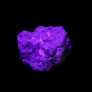 Spessartine garnet cluster 45*38*27mm 334ct 66.8g in UV light 
 - Rocks and Things Store