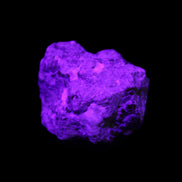 Spessartine garnet cluster 45*38*27mm 334ct 66.8g in UV light 
 - Rocks and Things Store