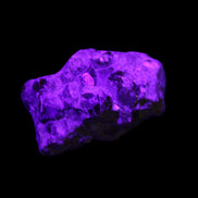 Spessartine garnet cluster 45*38*27mm 334ct 66.8g in UV light 
 - Rocks and Things Store