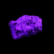 Spessartine garnet cluster 45*38*27mm 334ct 66.8g in UV light 
 - Rocks and Things Store