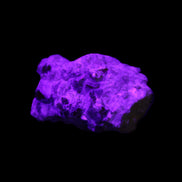 Spessartine garnet cluster 45*38*27mm 334ct 66.8g in UV light 
 - Rocks and Things Store