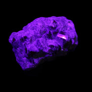 Spessartine garnet cluster 45*38*27mm 334ct 66.8g in UV light 
 - Rocks and Things Store