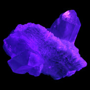 Elestial Quartz Soulmate cluster with Feldspar and Mica Bridge 424g in UV light