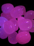 Mangano Calcite UV bright-pink-reactive tumbled stone 7-8g  in UV light - Rocks and Things Store