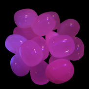 Mangano Calcite UV bright-pink-reactive tumbled stone 7-8g in UV light - Rocks and Things Store