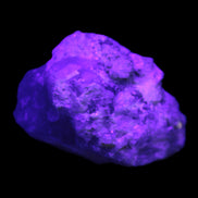 Quartz with UV reactive mica matrix  40*22*18mm 29g in UV light - Rocks and Things Store