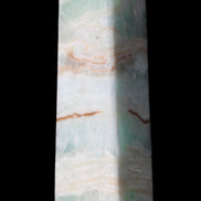 Pistachio Calcite obelisk 130mm 332g in sunlight - Rocks and Things Store