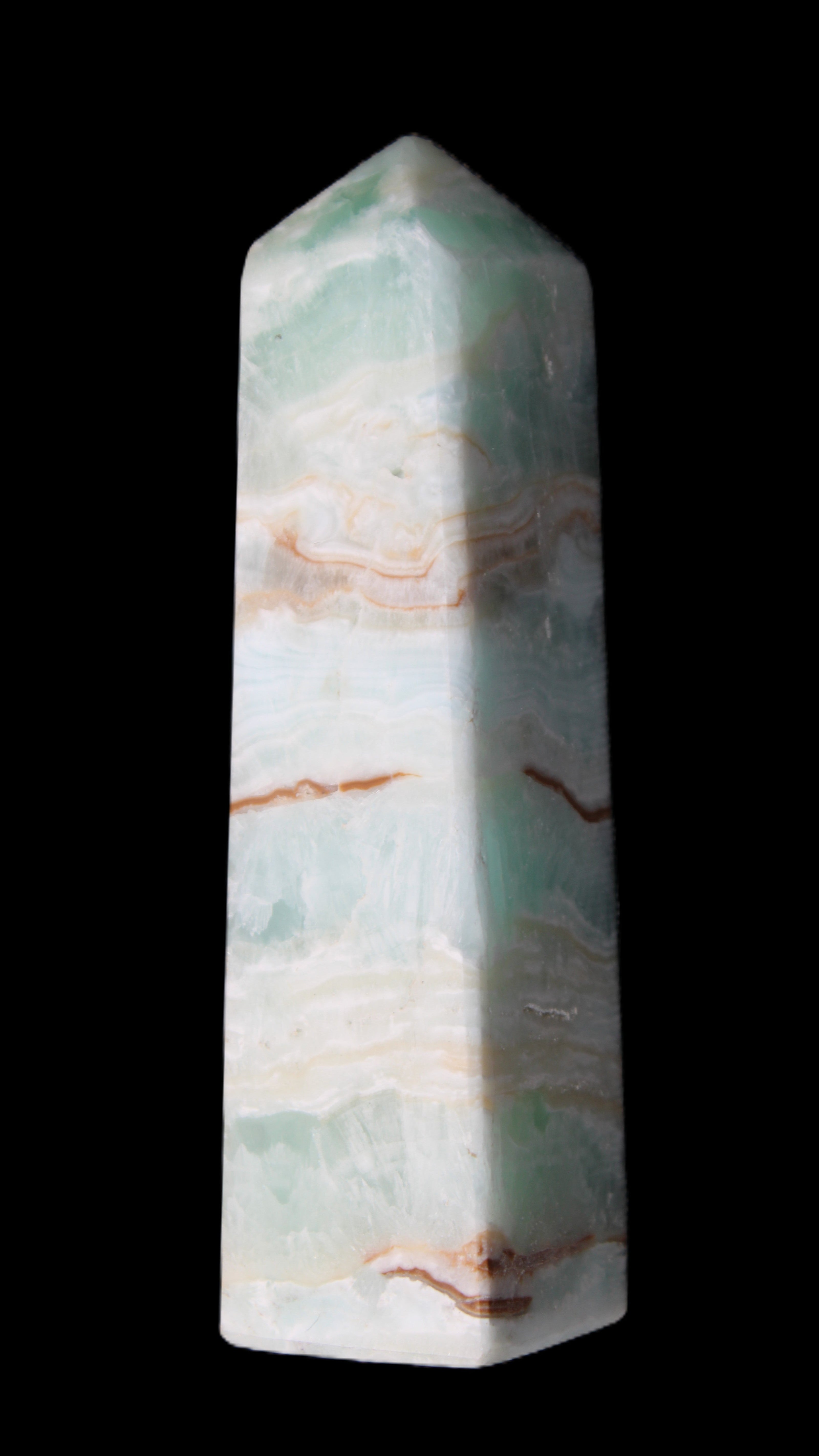 Pistachio Calcite obelisk 130mm 332g in sunlight - Rocks and Things Store