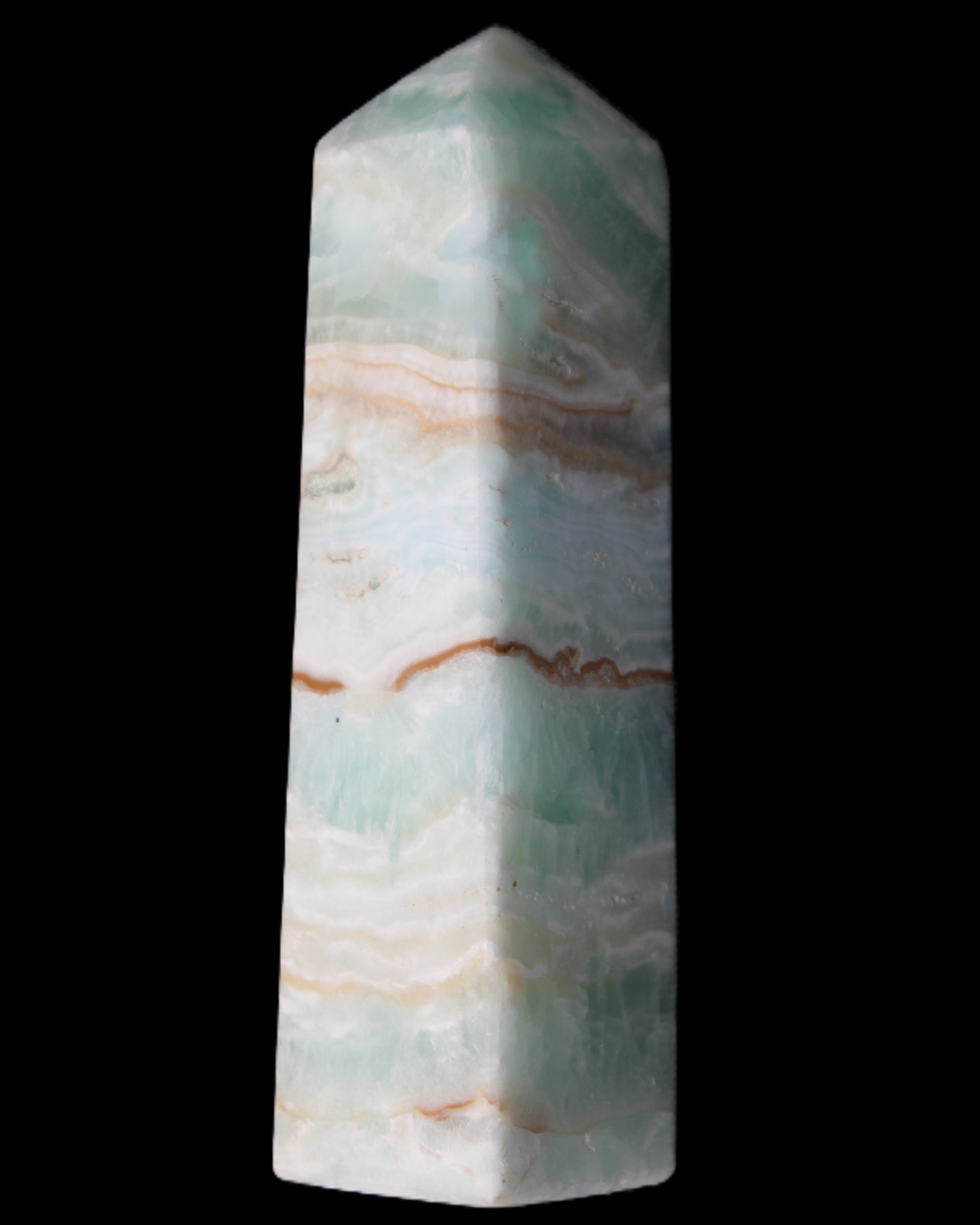 Pistachio Calcite obelisk 130mm 332g in sunlight - Rocks and Things Store