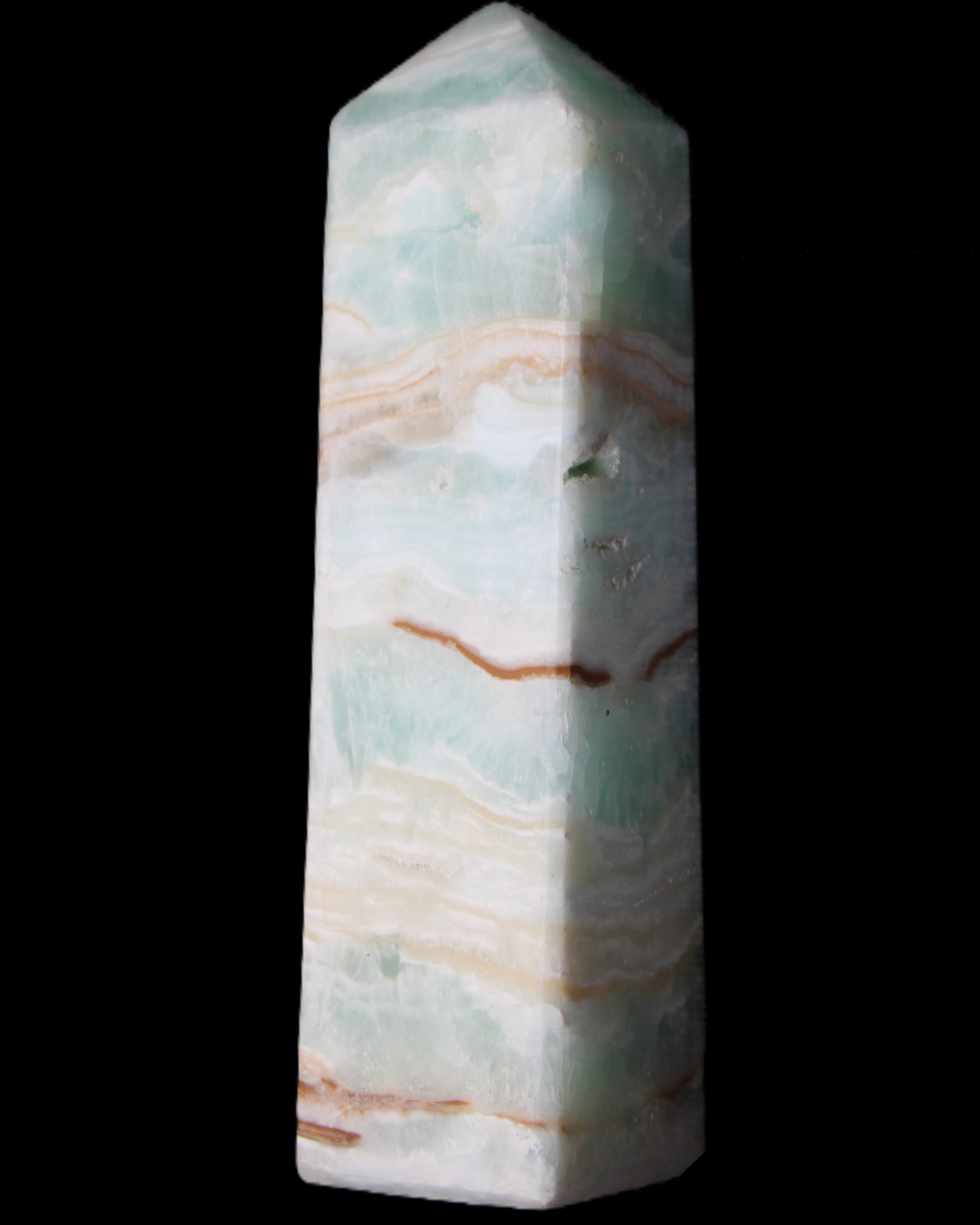 Pistachio Calcite obelisk 130mm 332g in sunlight - Rocks and Things Store