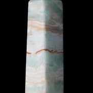 Pistachio Calcite obelisk 130mm 332g in sunlight - Rocks and Things Store