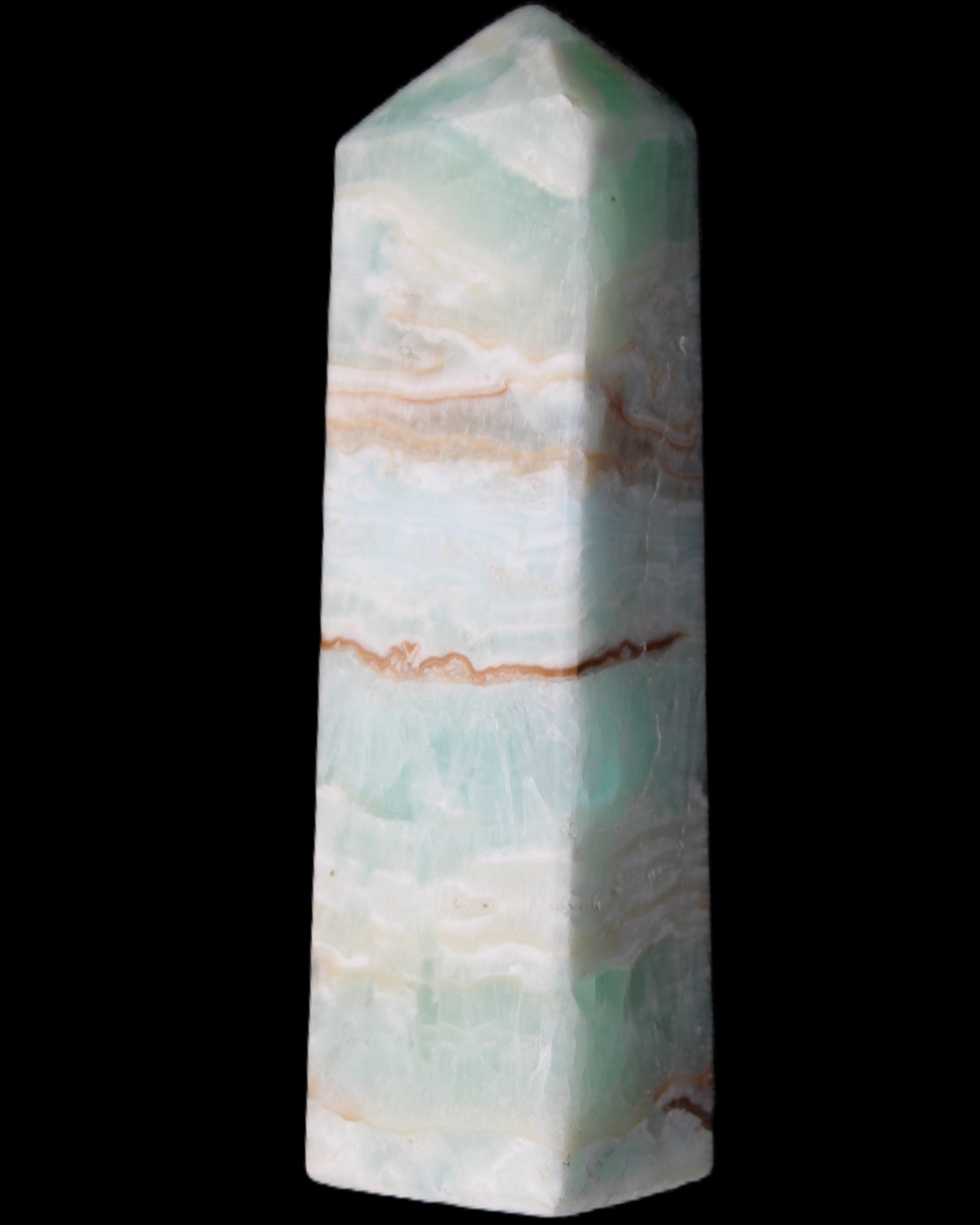Pistachio Calcite obelisk 130mm 332g in sunlight - Rocks and Things Store