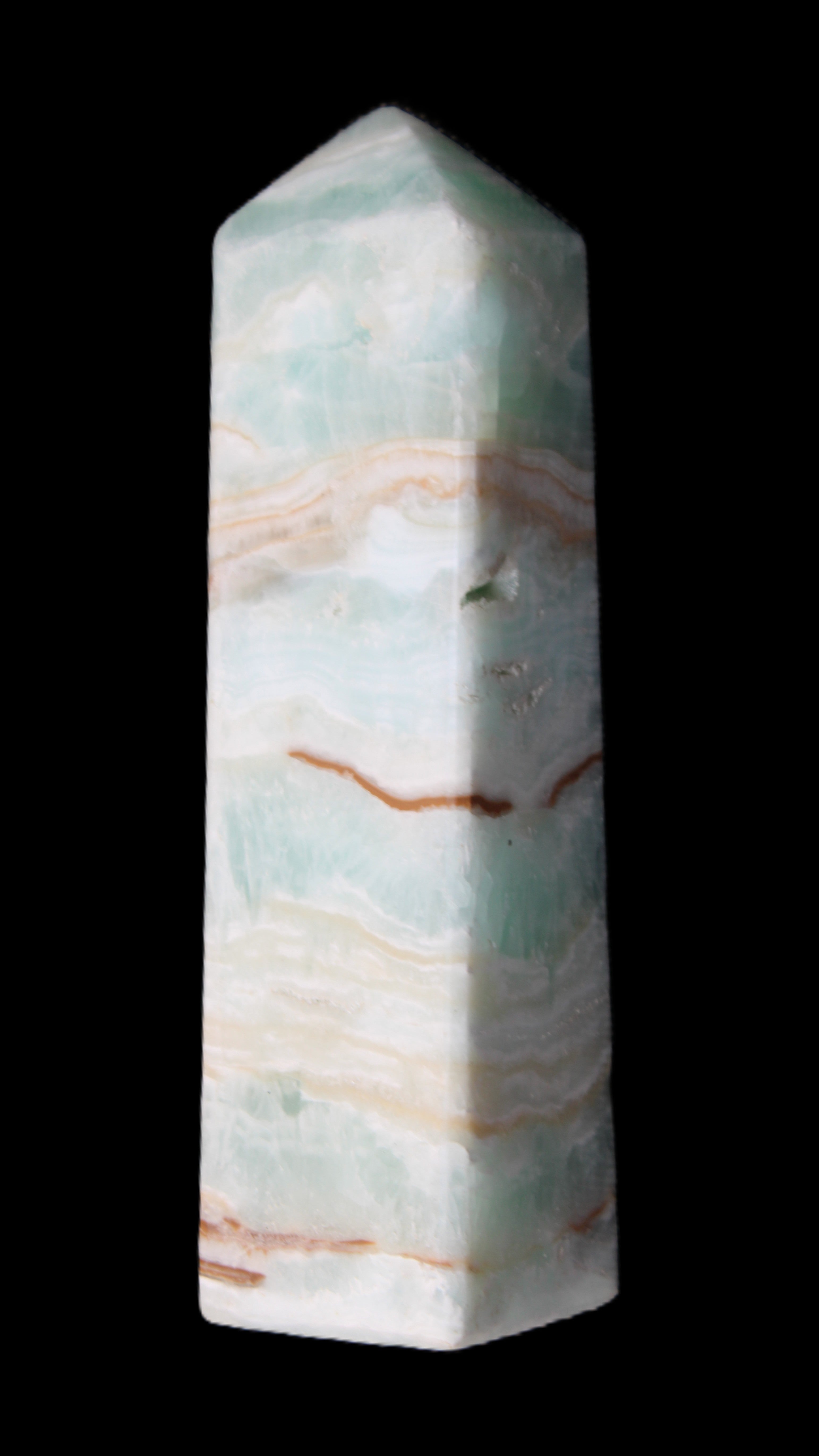 Pistachio Calcite obelisk 130mm 332g in sunlight - Rocks and Things Store