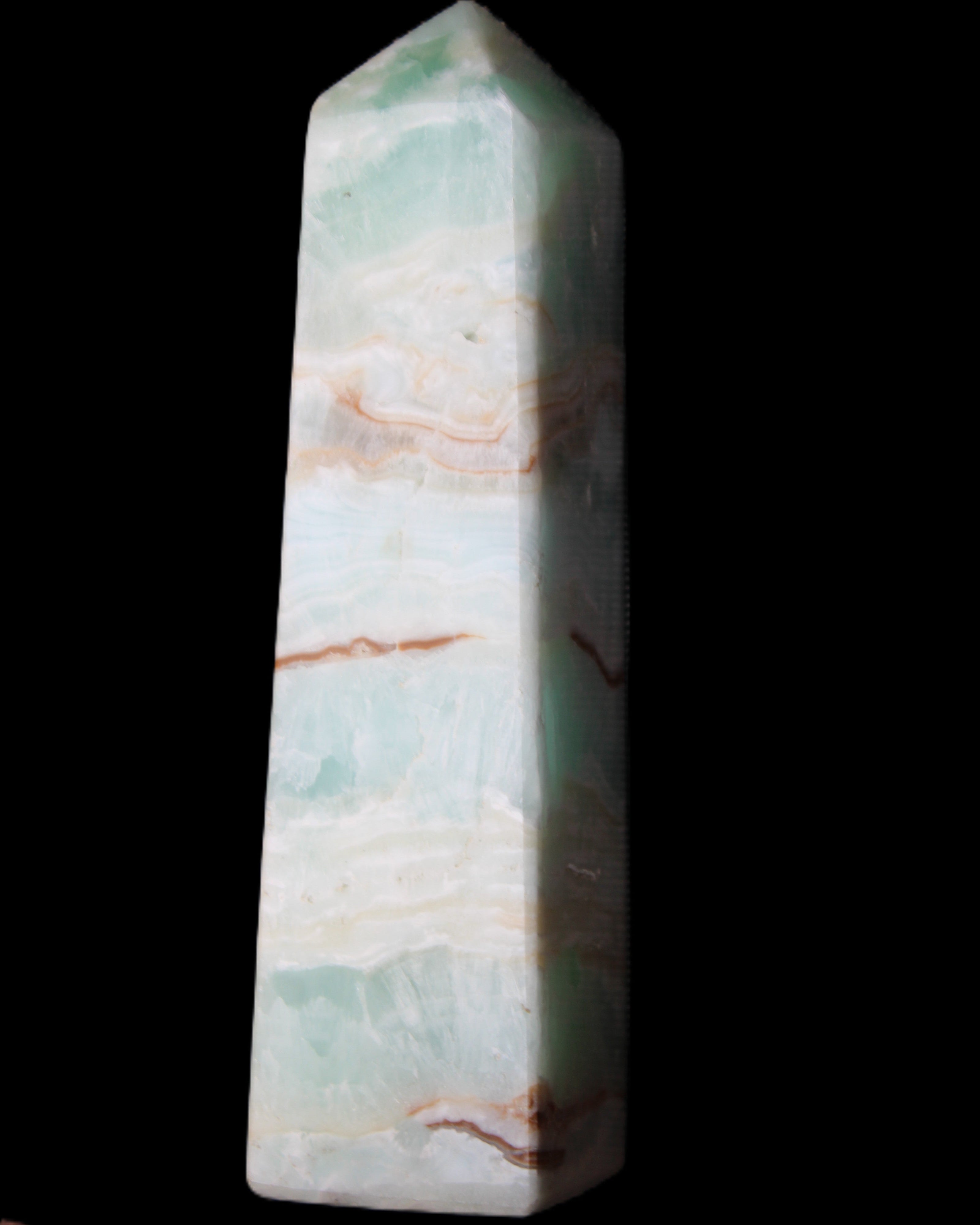 Pistachio Calcite obelisk 130mm 332g in sunlight - Rocks and Things Store