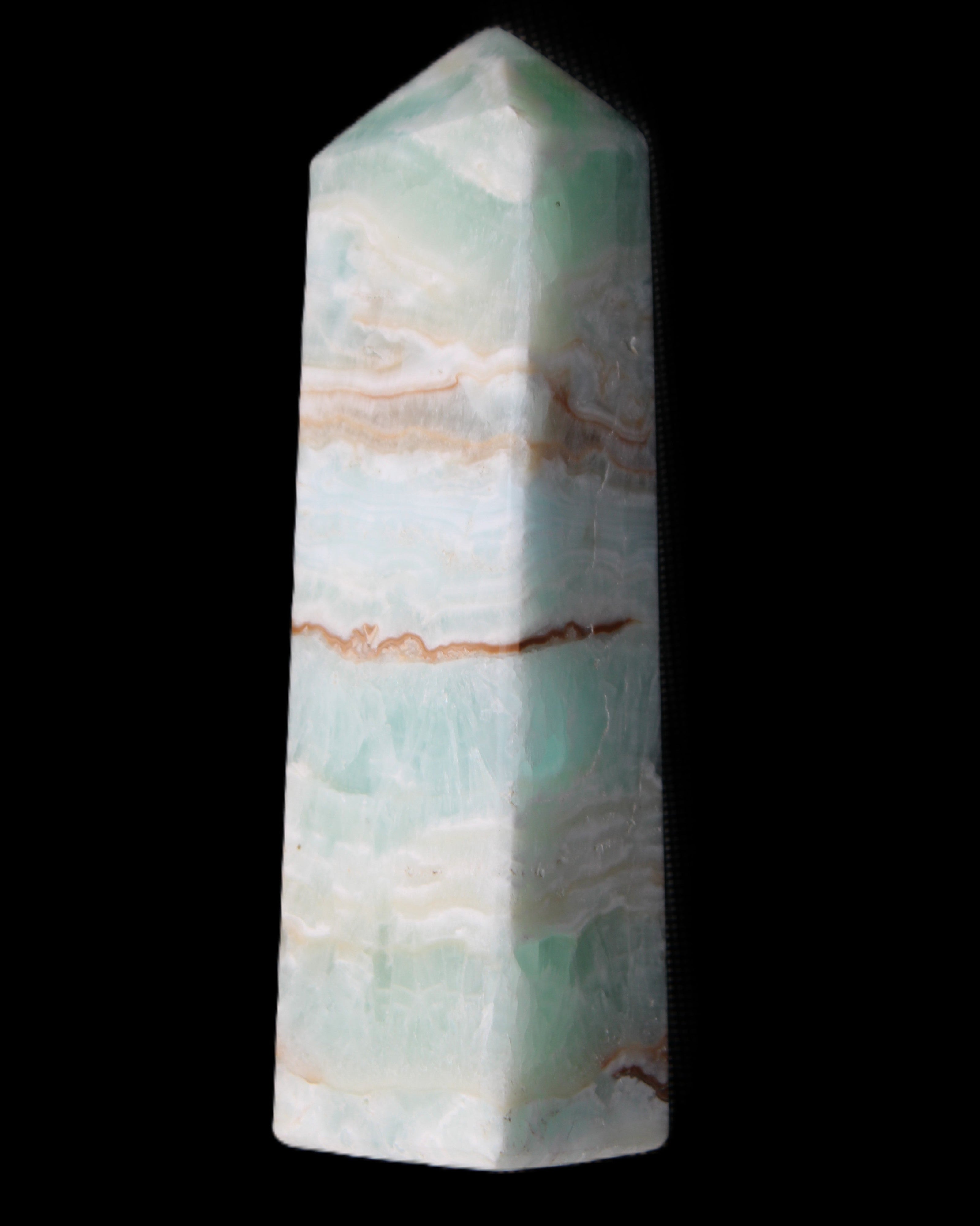 Pistachio Calcite obelisk 130mm 332g in sunlight - Rocks and Things Store