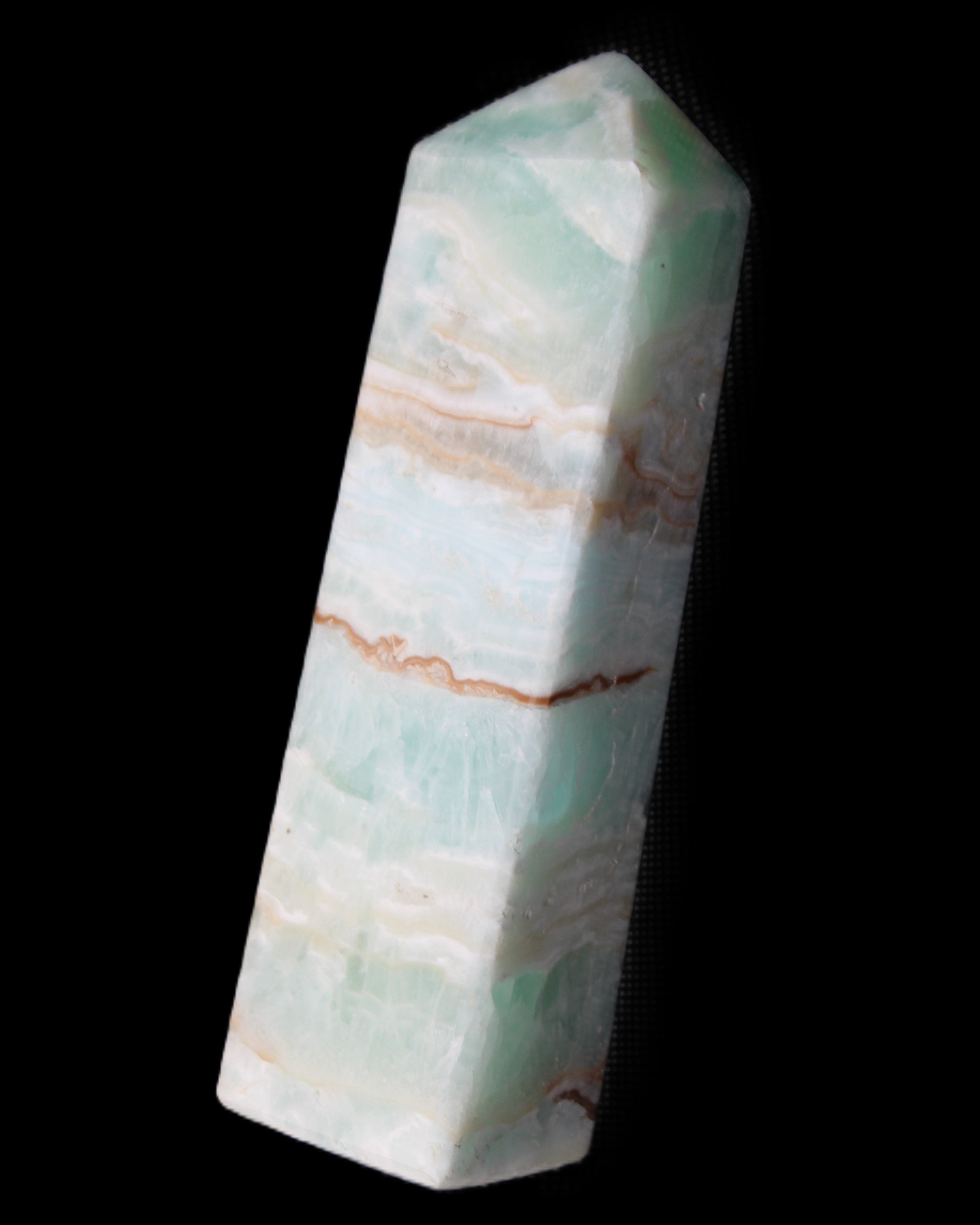Pistachio Calcite obelisk 130mm 332g in sunlight - Rocks and Things Store