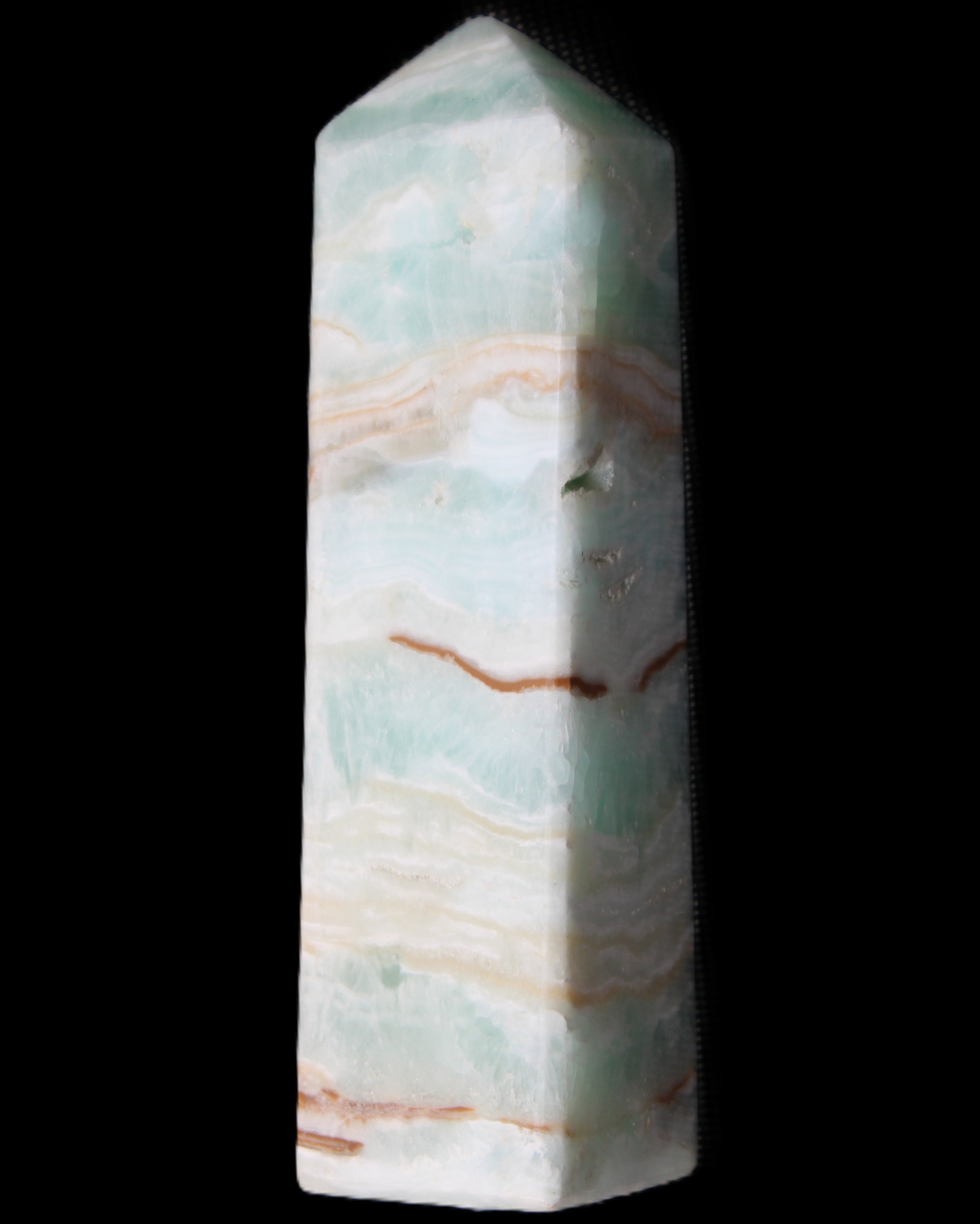 Pistachio Calcite obelisk 130mm 332g in sunlight - Rocks and Things Store