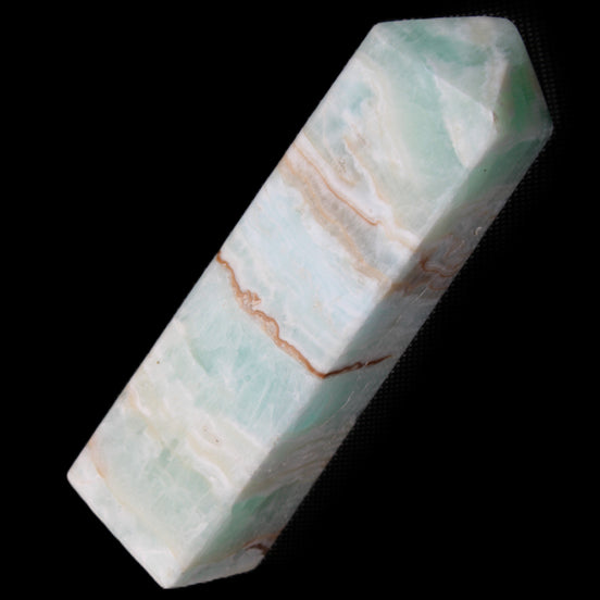 Pistachio Calcite obelisk 130mm 332g in sunlight - Rocks and Things Store