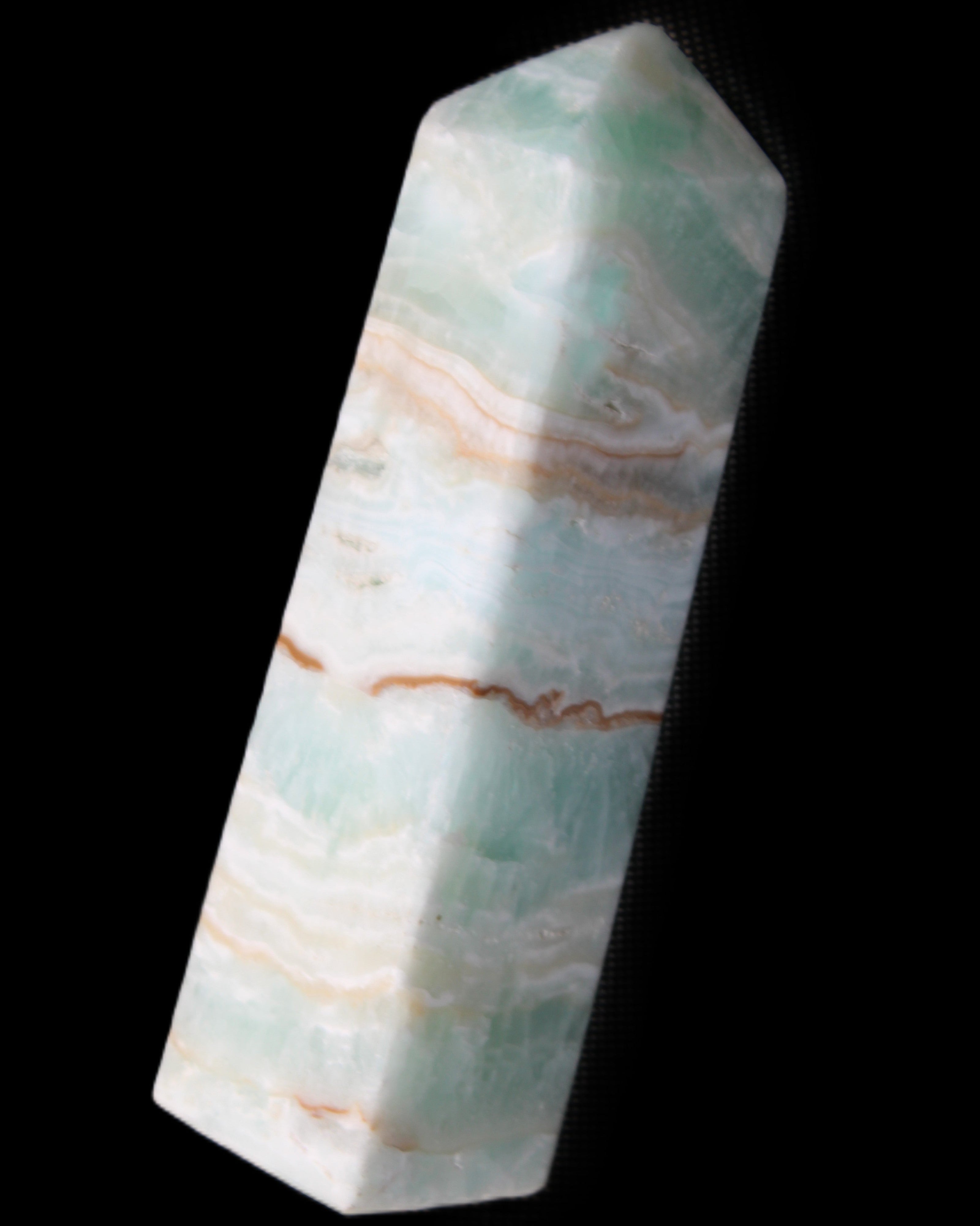 Pistachio Calcite obelisk 130mm 332g in sunlight - Rocks and Things Store