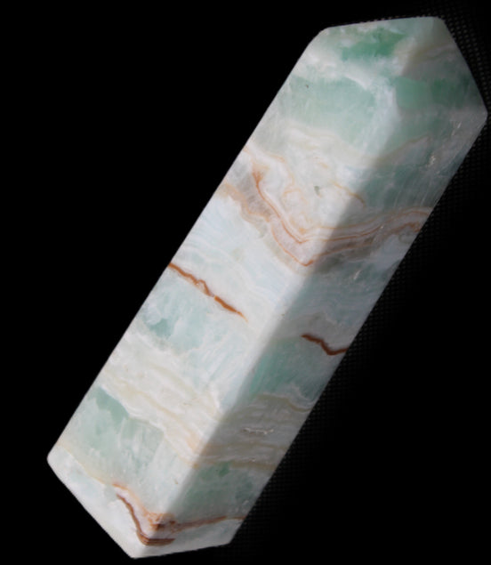 Pistachio Calcite obelisk 130mm 332g in sunlight - Rocks and Things Store