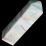Pistachio Calcite obelisk 130mm 332g in sunlight - Rocks and Things Store
