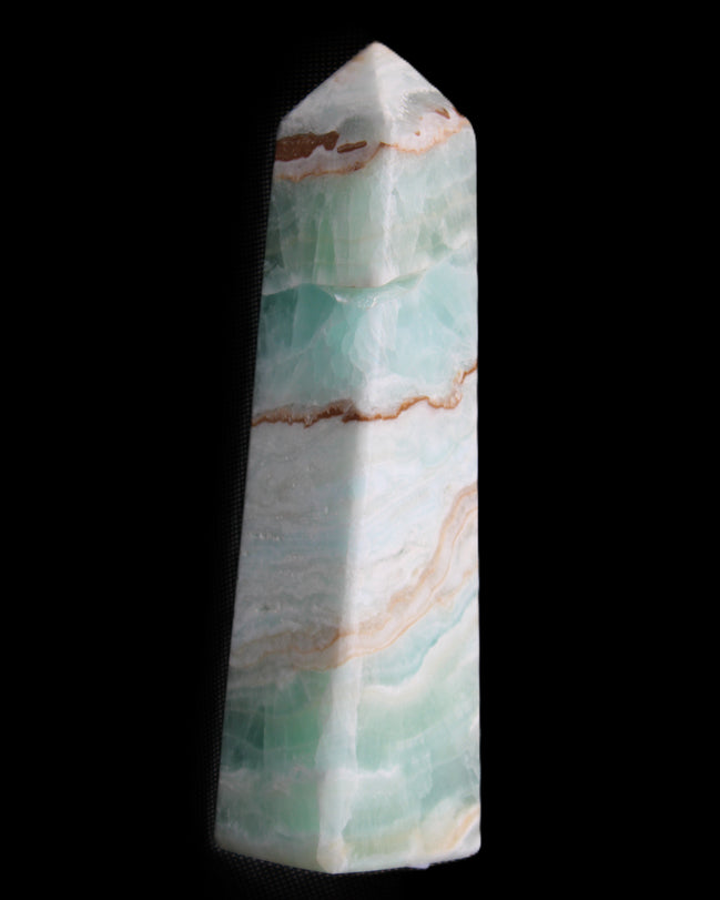 Pistachio Calcite obelisk 155mm 465g in sunlight - Rocks and Things Store