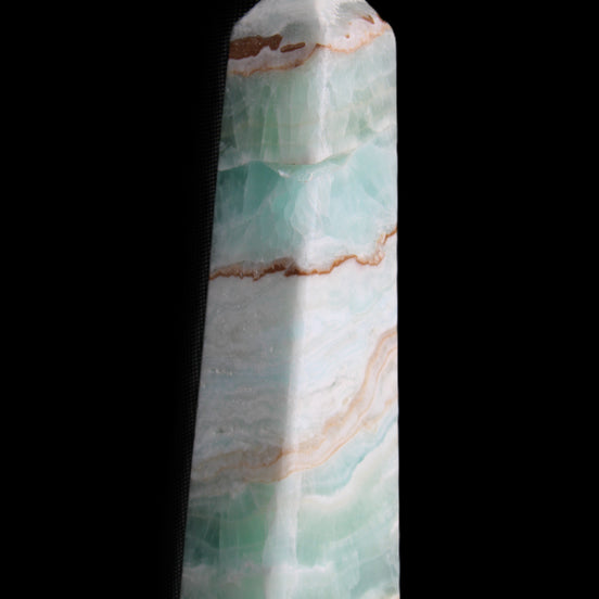 Pistachio Calcite obelisk 155mm 465g in sunlight - Rocks and Things Store
