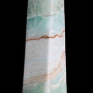 Pistachio Calcite obelisk 155mm 465g in sunlight - Rocks and Things Store