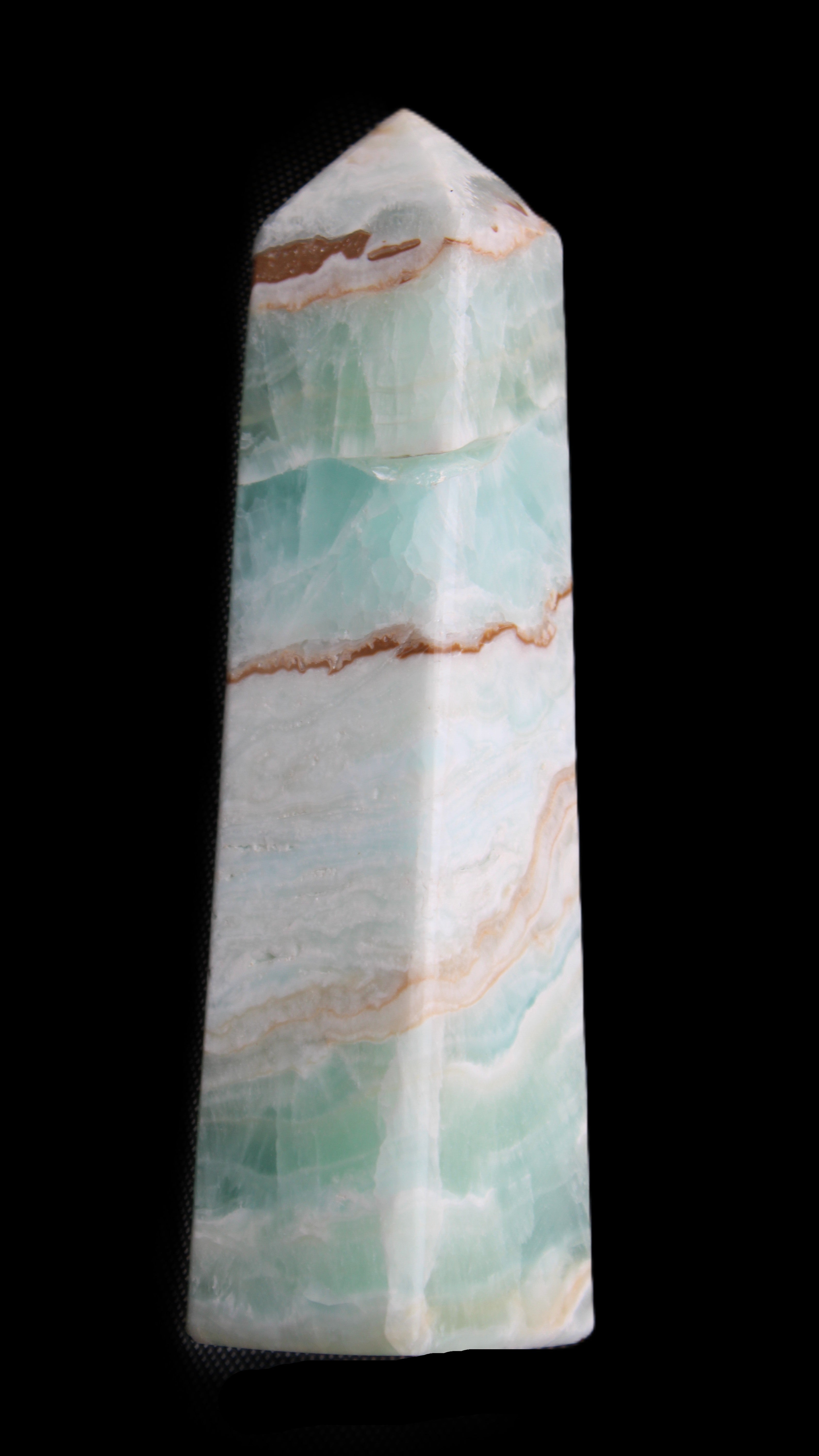 Pistachio Calcite obelisk 155mm 465g in sunlight - Rocks and Things Store
